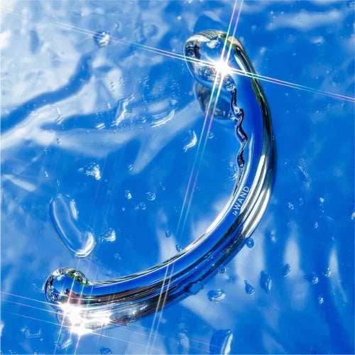 le wand hoop stainless steel massager against blue shiny background