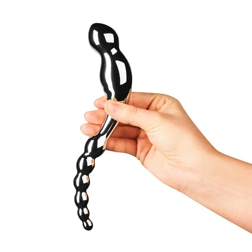 hand holding swerve dildo against white background
