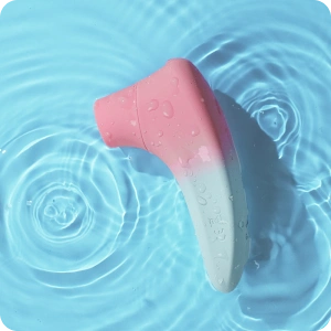 Pink and white silicone product on a blue water background