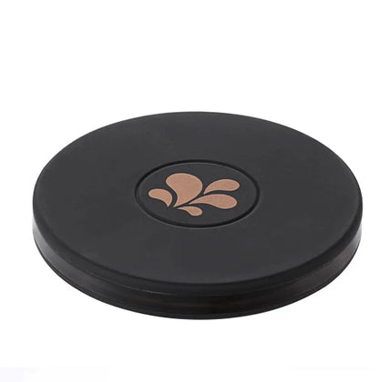 Round black maia wireless charging base with maia logo