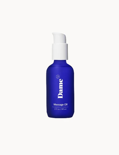 Dame Massage Oil - blue bottle against white background