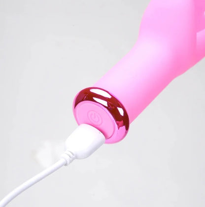 closeup of usb charger plugged into pink vibrator