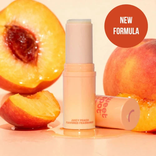fragrance stick with peaches and circle saying new formula