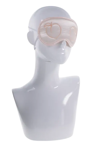 Peaches 'n CreaMe peach-colored satin blindfold with embroidered peaches on white mannequin head