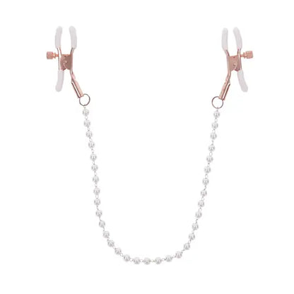 pearl nipples clamps with rose gold and white background