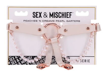 peach garters with rose gold accents and pearls on package