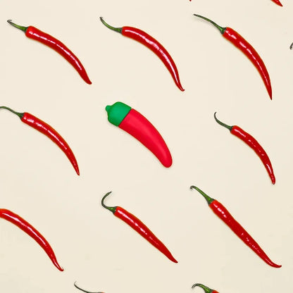 chili pepper vibrator against white background