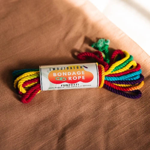 rainbow bondage rope on textile background