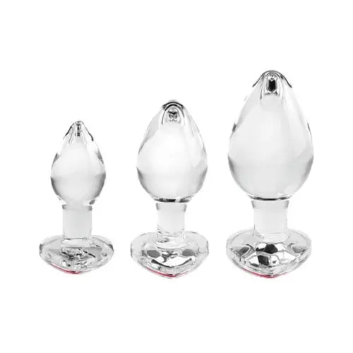 red gem set of three glass butt plugs in varying sizes against white background