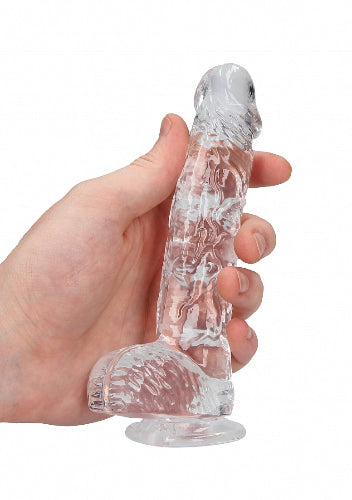 hand cradling clear dildo 