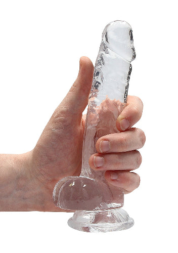 hand cradling crystal clear shots dildo