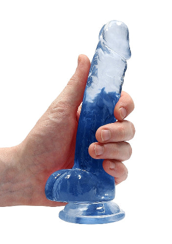 hand cradling crystal clear blue dildo