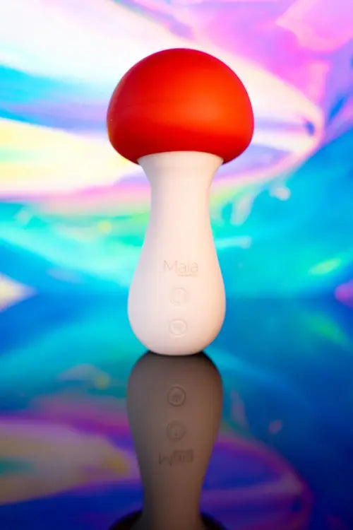 Shroomie Mushroom Vibrator against psychedelic background