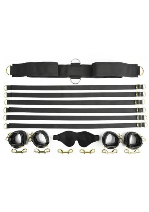 under the bed restraint set - black straps and cuffs against white background