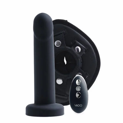 VeDO black vibrator in front of harness fixture with remote control