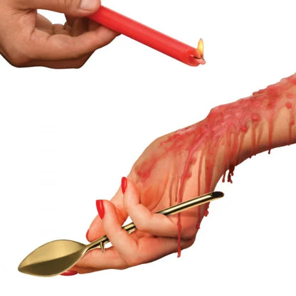 hand holding red candle over lover's wrist